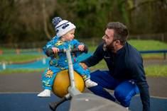 A person and a baby on a scooter
AI-generated content may be incorrect.